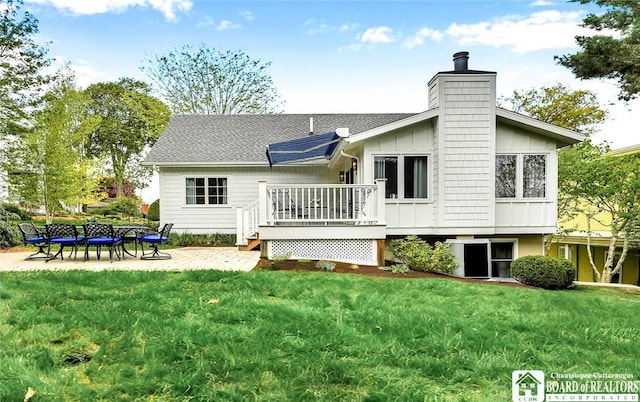 3 Maple Ave, Chautauqua, NY 14722 - rear view of house with a deck, a chimney, a yard, a patio area, and board and batten siding