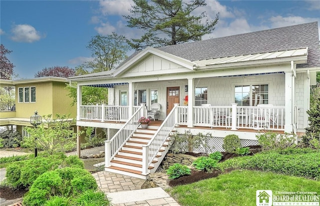 3 Maple Ave, Chautauqua, NY 14722 - view of front of home with a porch, roof with shingles, and stairs