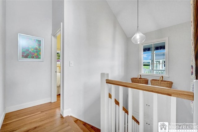 3 Maple Ave, Chautauqua, NY 14722 - hallway with an upstairs landing, wood finished floors, baseboards, and lofted ceiling