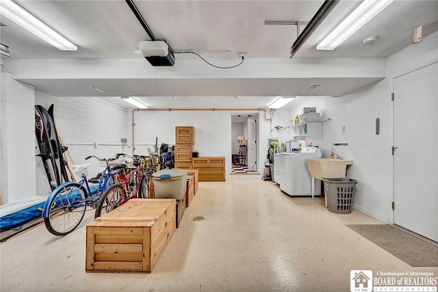 3 Maple Ave, Chautauqua, NY 14722 - garage with washer and clothes dryer, a garage door opener, and a sink