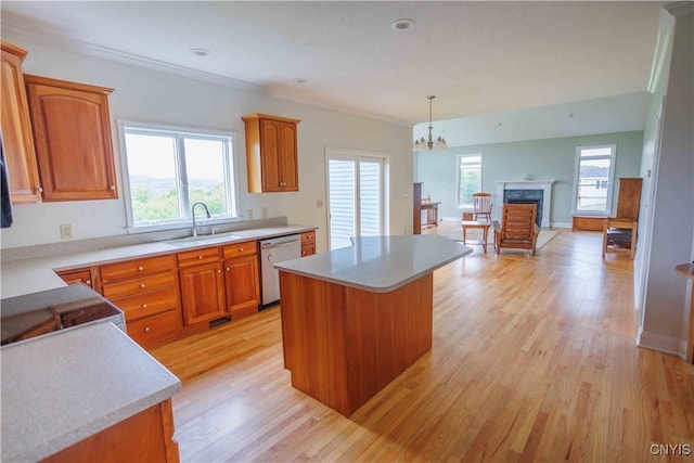 490 Hidden Falls Rd, Tully, NY 13159 - kitchen with a sink, stainless steel dishwasher, a chandelier, light wood-type flooring, and light countertops