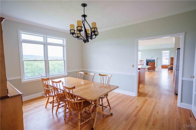 490 Hidden Falls Rd, Tully, NY 13159 - dining room featuring a chandelier, light wood-type flooring, ornamental molding, and baseboards
