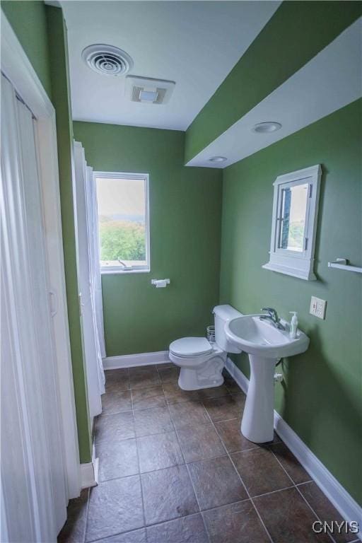 490 Hidden Falls Rd, Tully, NY 13159 - bathroom with baseboards, healthy amount of natural light, and toilet