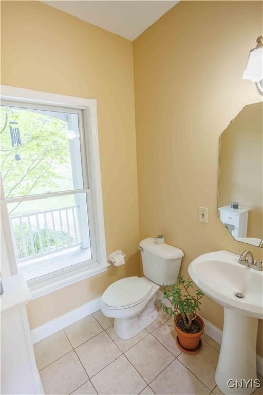 490 Hidden Falls Rd, Tully, NY 13159 - bathroom featuring tile patterned floors, baseboards, plenty of natural light, and toilet