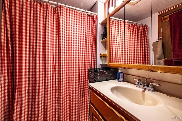 21 S Lake Rd, Deruyter, NY 13052 - bathroom featuring vanity, a textured ceiling, and a shower with shower curtain