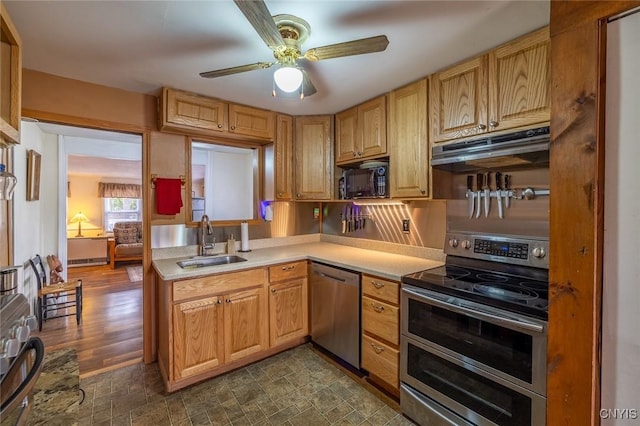 21 S Lake Rd, Deruyter, NY 13052 - kitchen with stainless steel appliances, a sink, under cabinet range hood, and light countertops