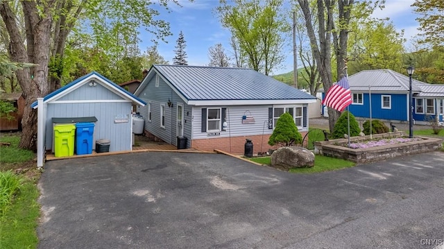 21 S Lake Rd, Deruyter, NY 13052 - view of front facade with asphalt driveway and metal roof
