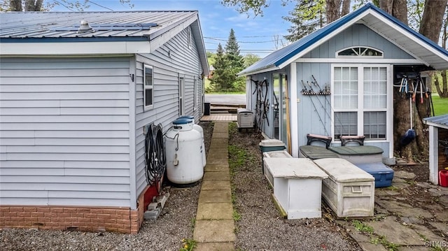 21 S Lake Rd, Deruyter, NY 13052 - view of home's exterior with metal roof and an outbuilding