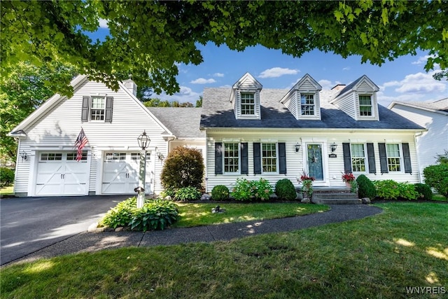 cape cod home featuring asphalt driveway, a front yard, and a garage