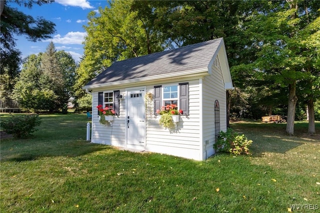 view of outdoor structure with an outbuilding and view of scattered trees