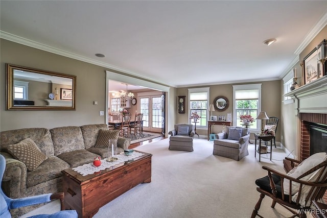 carpeted living area featuring ornamental molding, a chandelier, and a brick fireplace