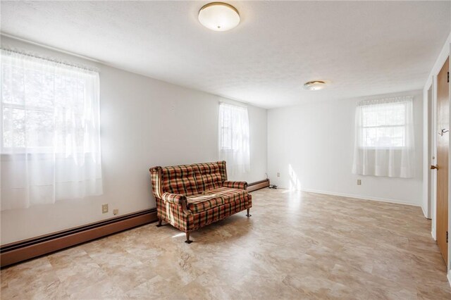 89 Chapel St, Mount Morris, NY 14510 - living area featuring a baseboard radiator