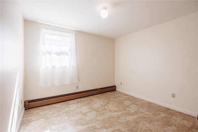 89 Chapel St, Mount Morris, NY 14510 - spare room featuring a baseboard radiator and baseboards