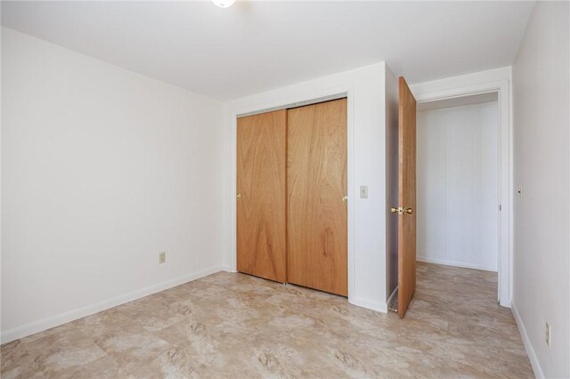 89 Chapel St, Mount Morris, NY 14510 - unfurnished bedroom featuring a closet and baseboards
