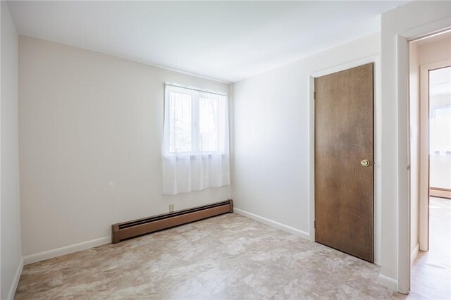 89 Chapel St, Mount Morris, NY 14510 - spare room with a baseboard heating unit and baseboards