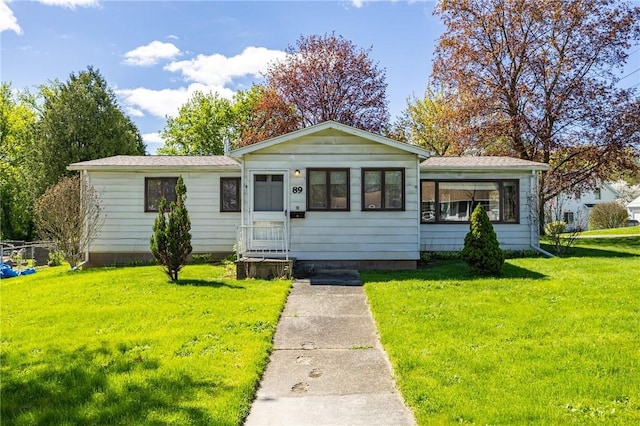 89 Chapel St, Mount Morris, NY 14510 - view of front of property with a front lawn