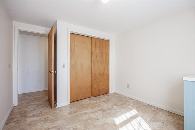 89 Chapel St, Mount Morris, NY 14510 - unfurnished bedroom featuring a closet and baseboards