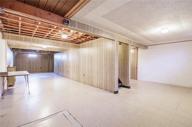 89 Chapel St, Mount Morris, NY 14510 - finished below grade area with tile patterned floors and wood walls