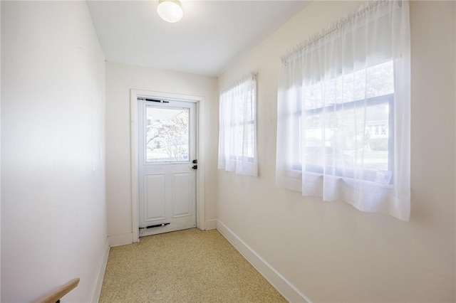 89 Chapel St, Mount Morris, NY 14510 - doorway with baseboards and light colored carpet