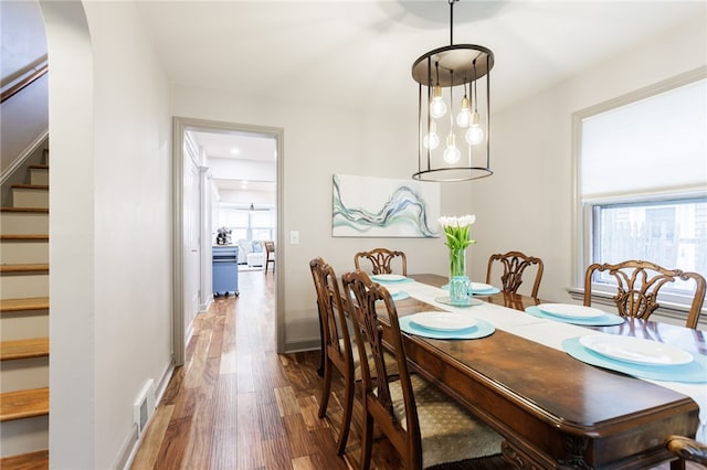 164 Elm Dr, Rochester, NY 14609 - dining area with stairs and wood finished floors