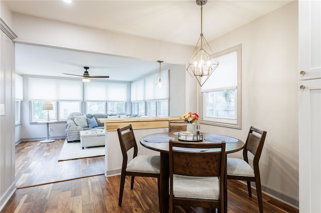 164 Elm Dr, Rochester, NY 14609 - dining space featuring wood finished floors, baseboards, ceiling fan, and a chandelier