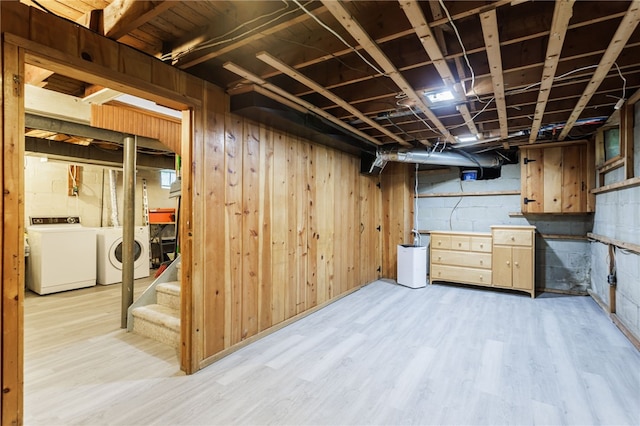 164 Elm Dr, Rochester, NY 14609 - unfinished below grade area featuring washer and dryer, light wood-type flooring, and stairway