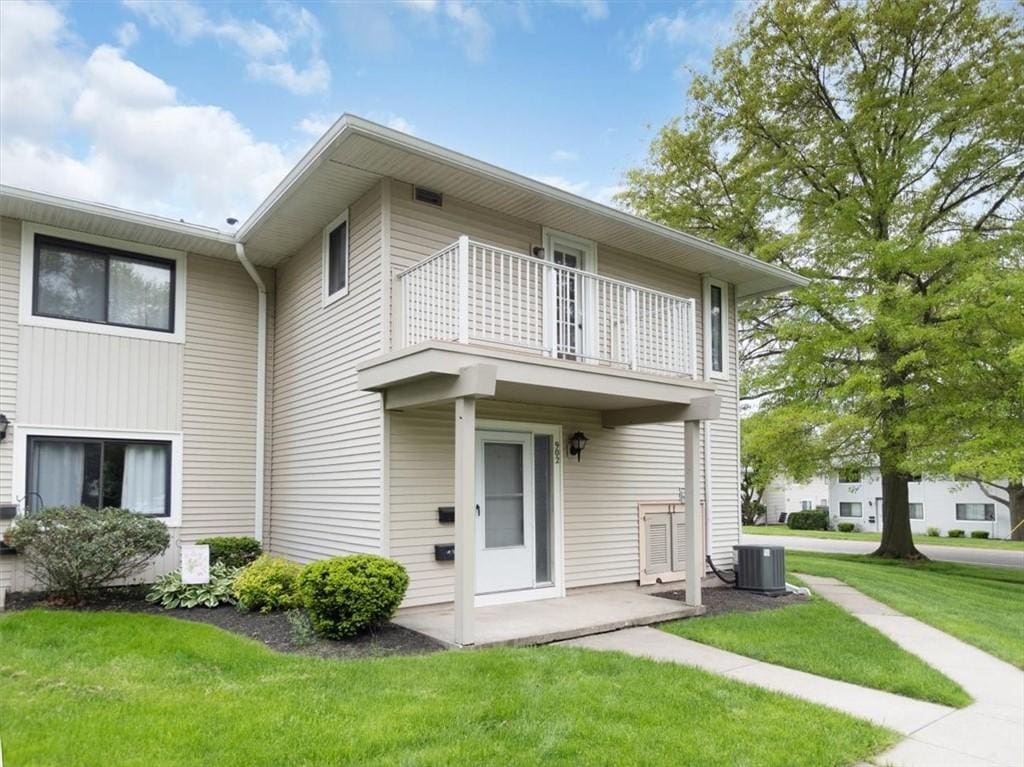 902 Eastbrooke Ln, Brighton, NY 14618 - view of front of property with a balcony, a front yard, and central air condition unit