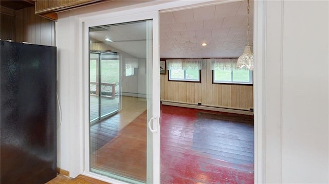 22 Suncrest Ter, Oneonta-City, NY 13820 - spare room with wood-type flooring, a baseboard heating unit, a baseboard radiator, and wood walls