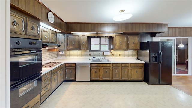 22 Suncrest Ter, Oneonta-City, NY 13820 - kitchen featuring black appliances, decorative backsplash, light countertops, and a sink