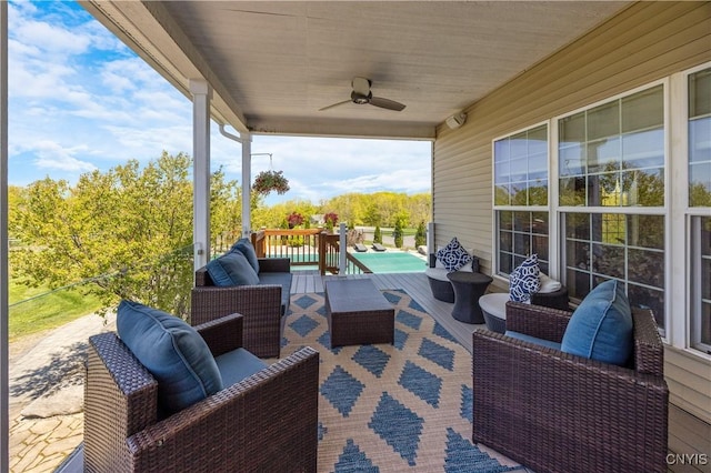 view of patio with outdoor lounge area and a ceiling fan