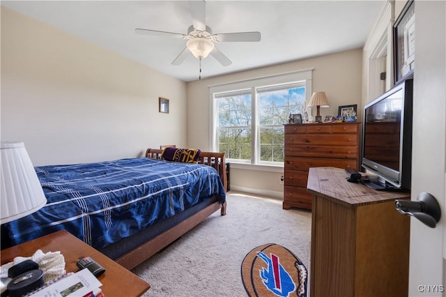 bedroom featuring carpet flooring, a ceiling fan, and baseboards