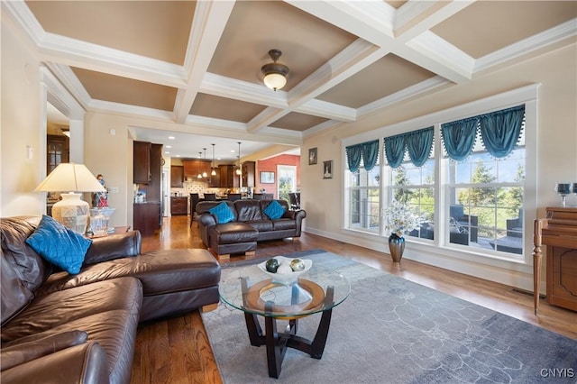 living room with wood finished floors, coffered ceiling, beamed ceiling, crown molding, and baseboards