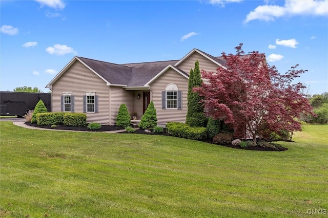 view of front of house with a front yard and roof with shingles