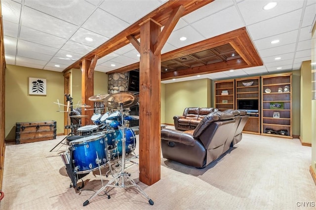 carpeted living area featuring recessed lighting and a paneled ceiling