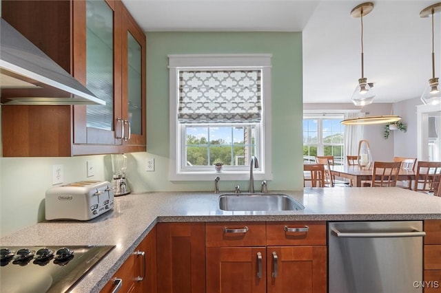 kitchen with a sink, dishwasher, wall chimney exhaust hood, and brown cabinets