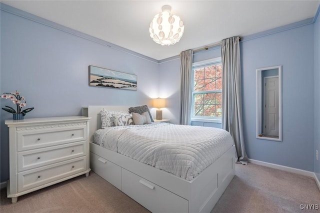 bedroom with light carpet and baseboards