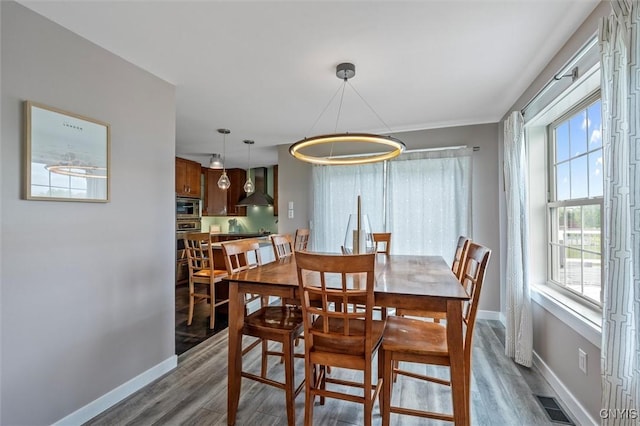 dining room with wood finished floors and baseboards