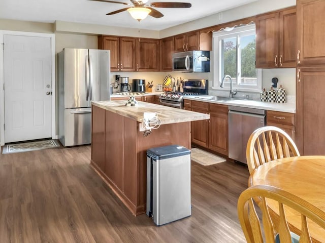 163 Lyncourt Park, Greece, NY 14612 - kitchen featuring stainless steel appliances, a sink, dark wood finished floors, and a center island