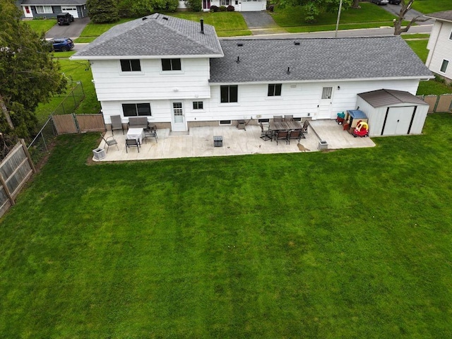 163 Lyncourt Park, Greece, NY 14612 - back of property with roof with shingles, a storage unit, a patio area, and an outbuilding