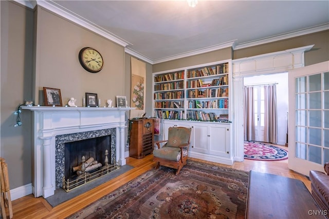 528 Garden St, Little Falls-City, NY 13365 - living area featuring crown molding, a fireplace, and wood finished floors
