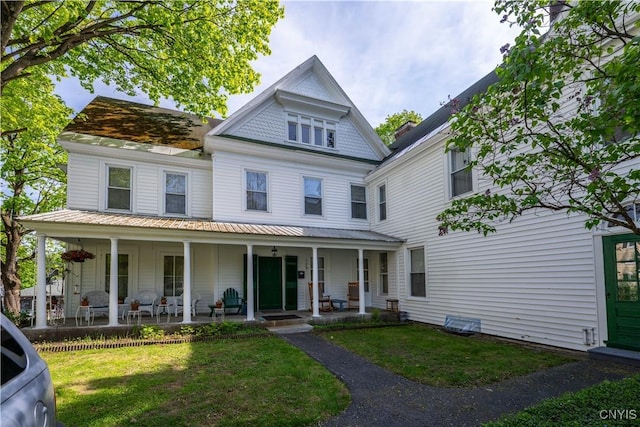 528 Garden St, Little Falls-City, NY 13365 - victorian house with a front lawn and covered porch