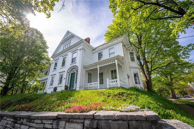528 Garden St, Little Falls-City, NY 13365 - victorian house with covered porch and a chimney