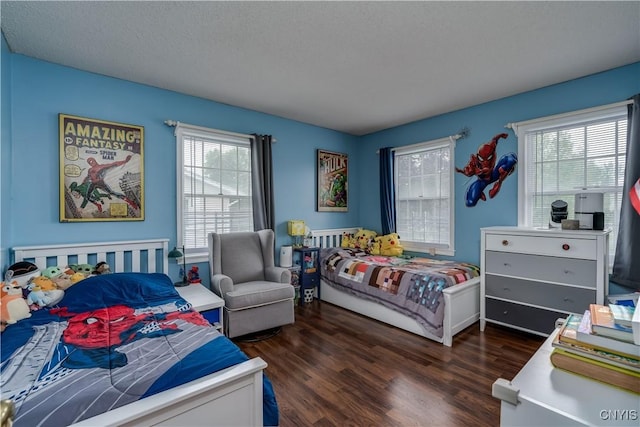 467 Barben Ave, Watertown-City, NY 13601 - bedroom featuring dark wood-type flooring and a textured ceiling