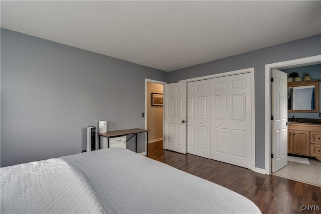467 Barben Ave, Watertown-City, NY 13601 - bedroom with dark wood-style flooring, baseboards, and a closet
