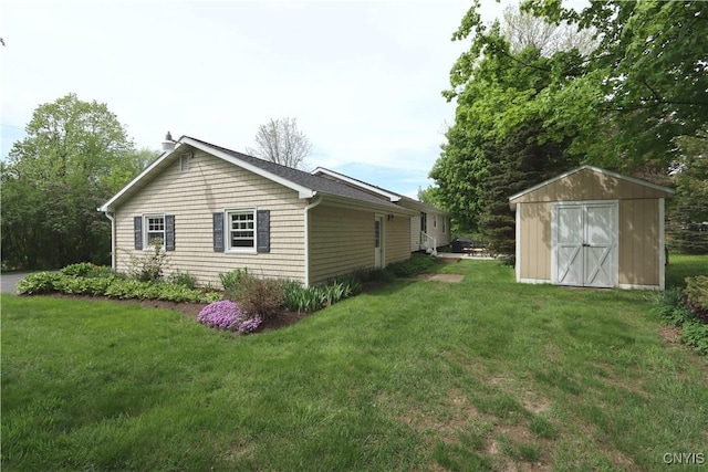 view of home's exterior featuring a storage shed, an outbuilding, a lawn, and a chimney