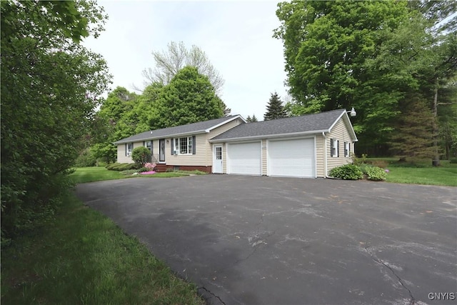 view of front of property with driveway and an attached garage