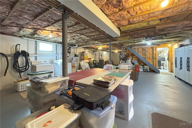 below grade area with stairs and separate washer and dryer
