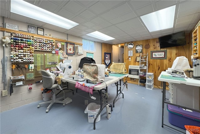 office space featuring wood walls