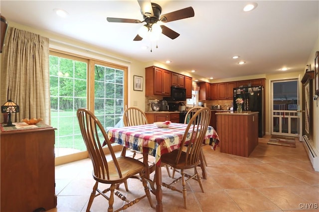 dining space featuring light tile patterned flooring, recessed lighting, ceiling fan, and a baseboard radiator