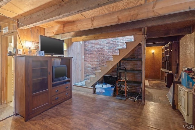 419 Glenwood Ln, Niles, NY 13021 - living area featuring wood finished floors, stairway, beam ceiling, and wood walls